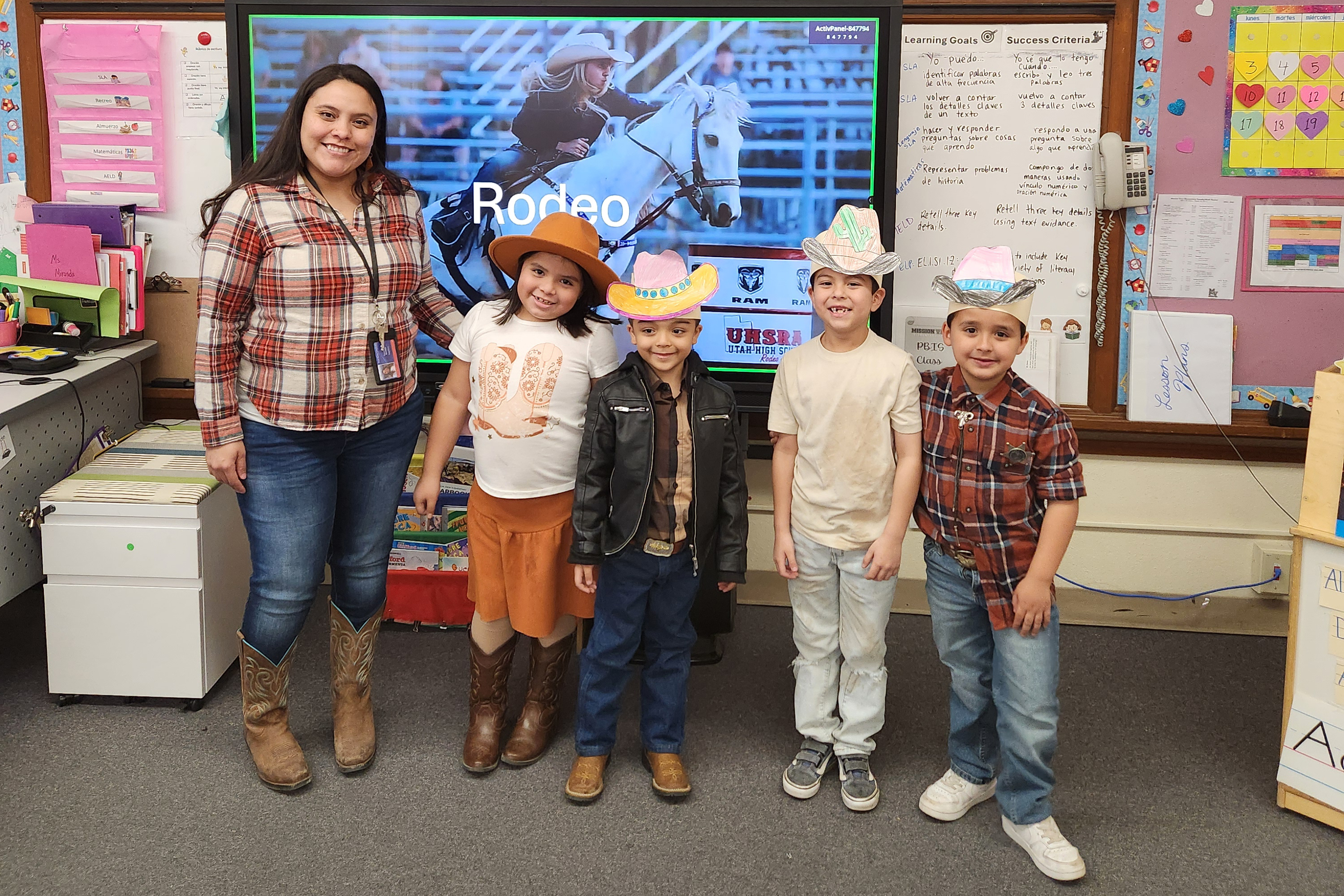 A teacher and four of her students show off their western outfits!