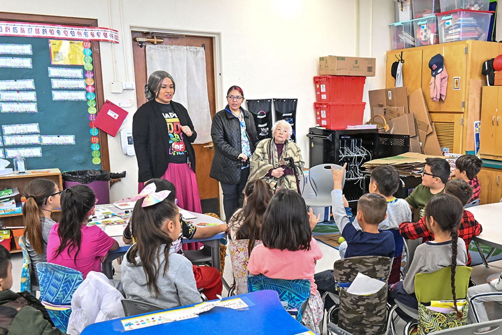 Delores Ortiz talks to students on the 100th day of school