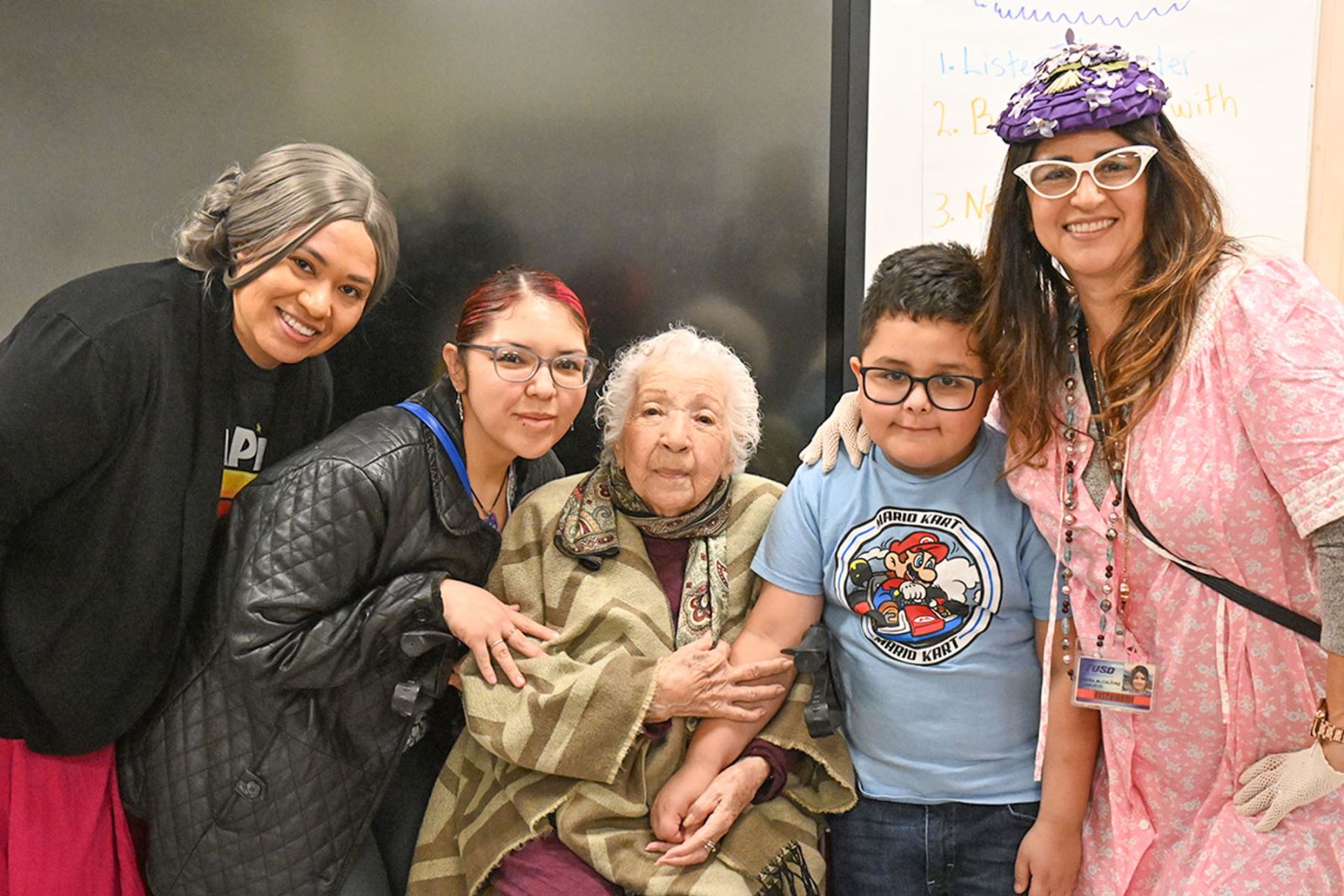 Delores Ortiz poses with teachers and a student